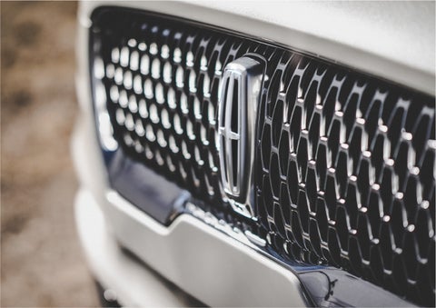 The grille of the 2023 Lincoln Aviator® Reserve model with an eye-catching repeated field of Lincoln Star logo shapes | Mike Reichenbach Lincoln in Florence SC