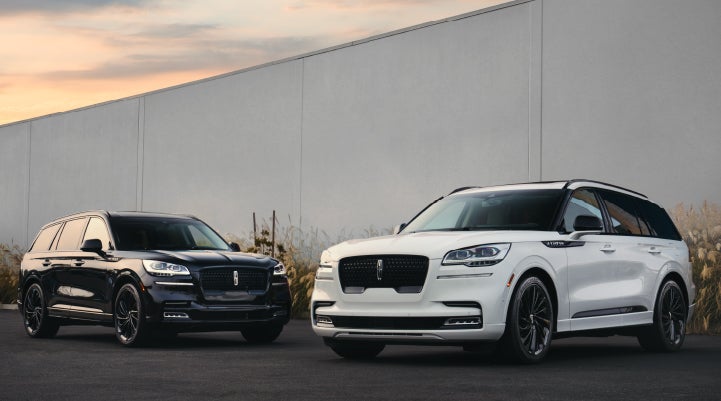Two Lincoln Aviator® SUVs are shown with the available Jet Appearance Package | Mike Reichenbach Lincoln in Florence SC